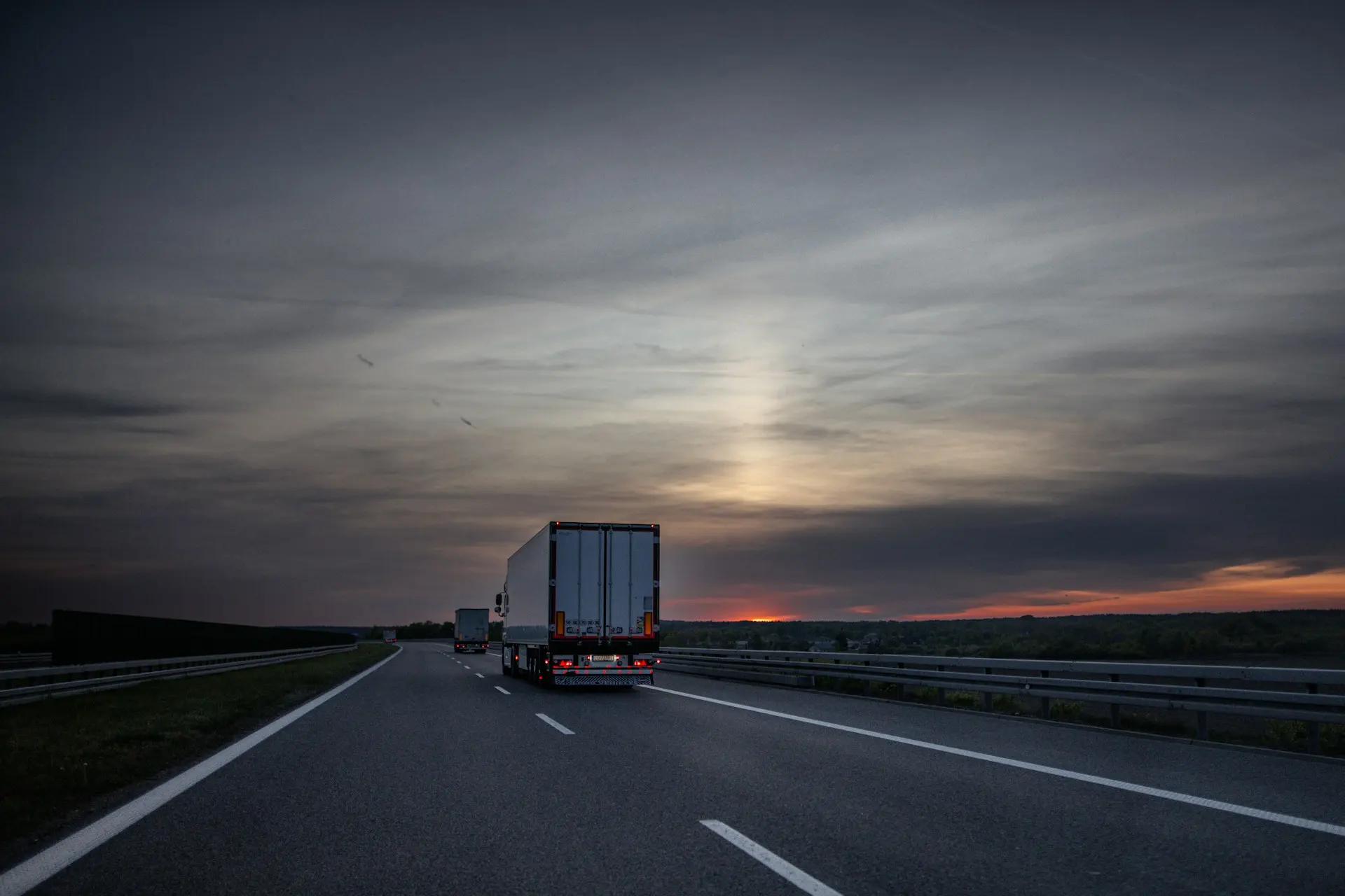 Insaaf Transport truck on the highway at sunset, delivering safely across Pakistan